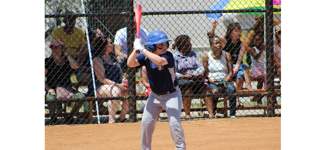 one player from Team Rockies (minor division)  ready to hit the ball out of this park